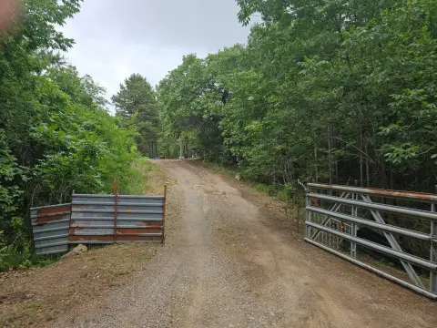 Land with Pond and Cabins