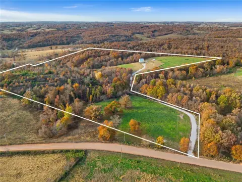 Fenced Agricultural Land with Farmhouse