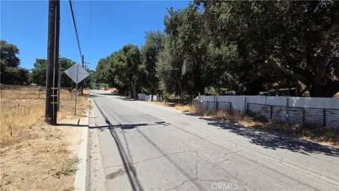 Fenced Uphill Residential Development Lot