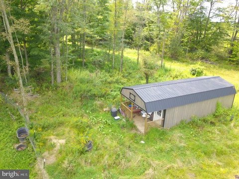 Unrestricted Acreage with Shed and Garage