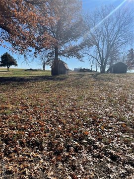 Land with Barns and Pond