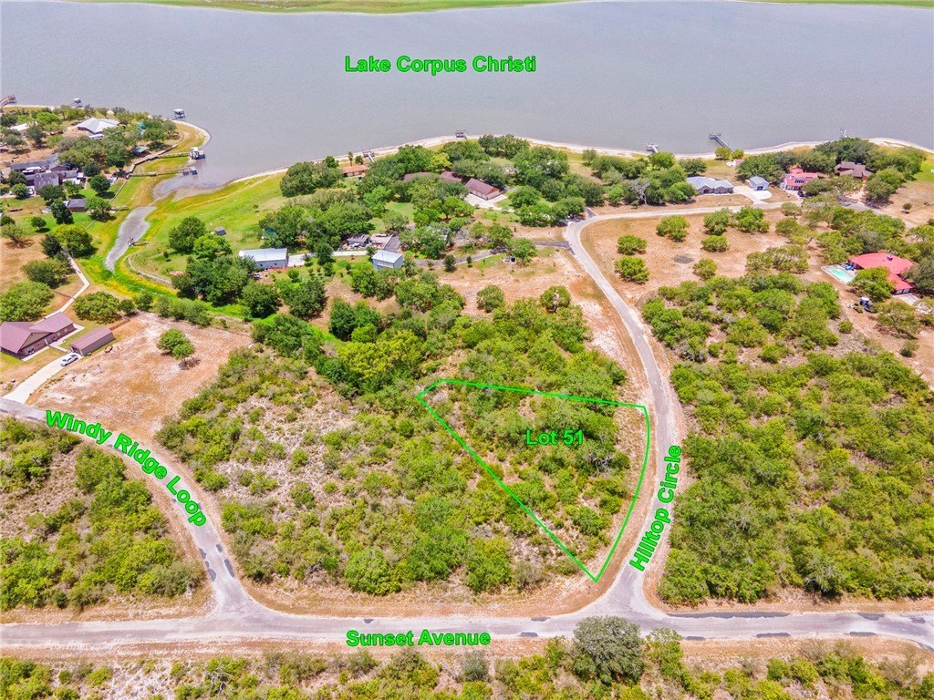 Tree-Filled Lot Near Lake