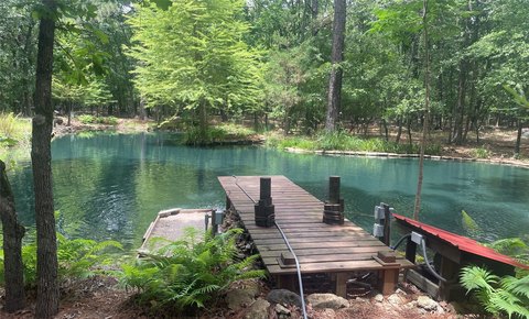 Land with Pond Near Lake