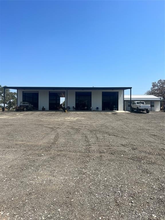 Unimproved Land with Metal Building