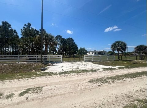 Fenced Residential Acreage with Shed