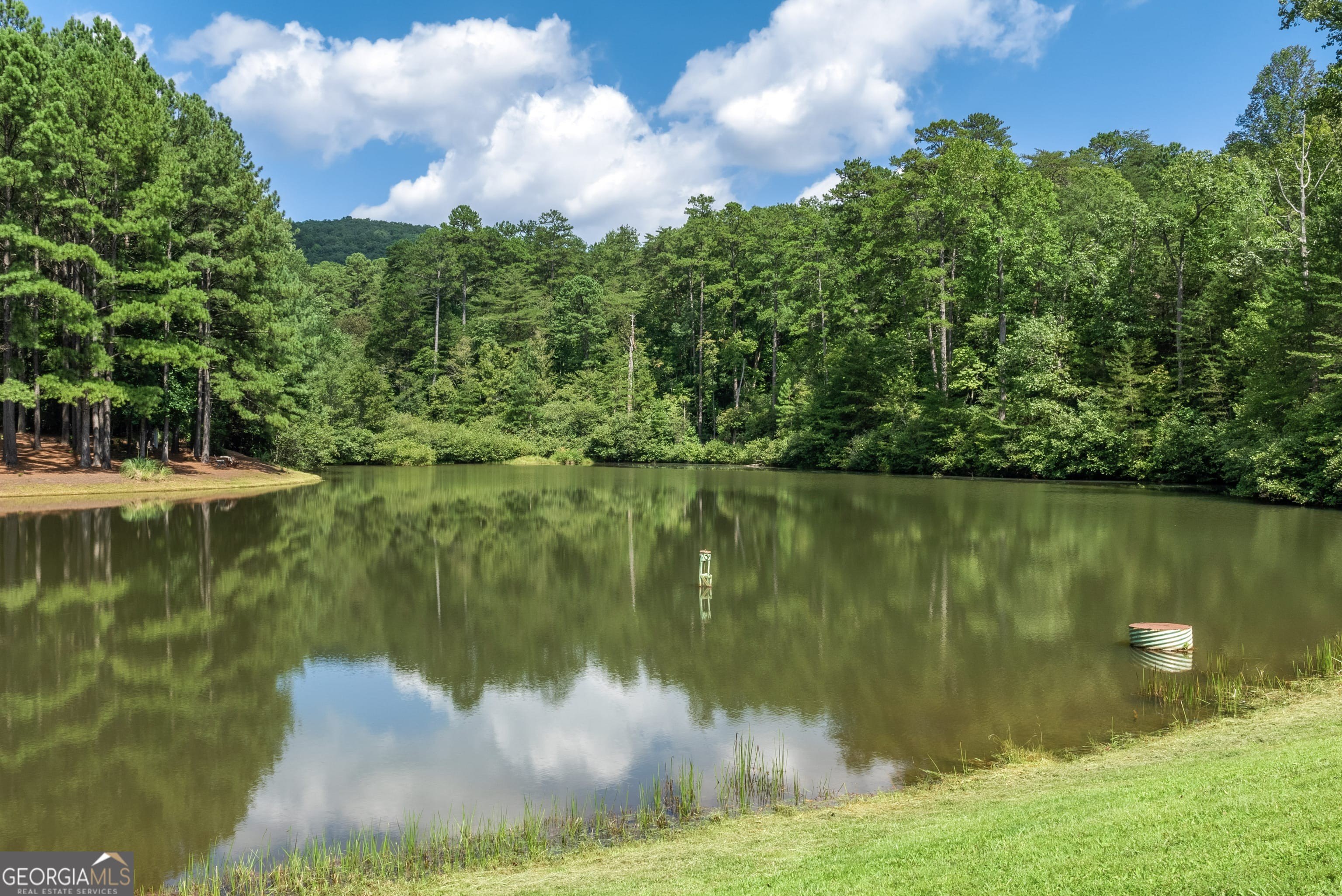Land with Mountain and Pond Views