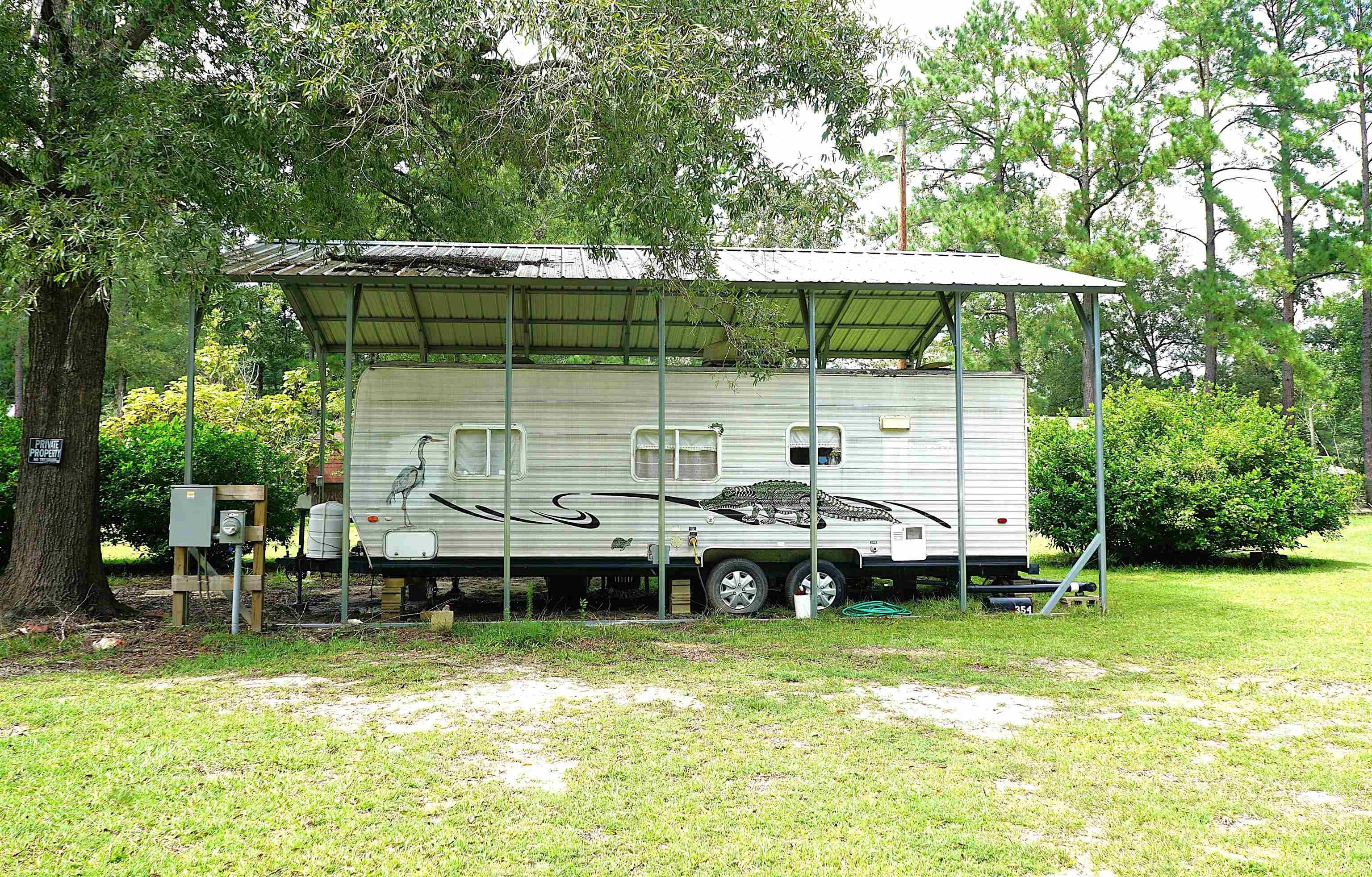 Residential Riverfront Lot with Camper