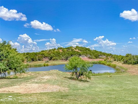 Fenced Ranch Land with Water Tanks