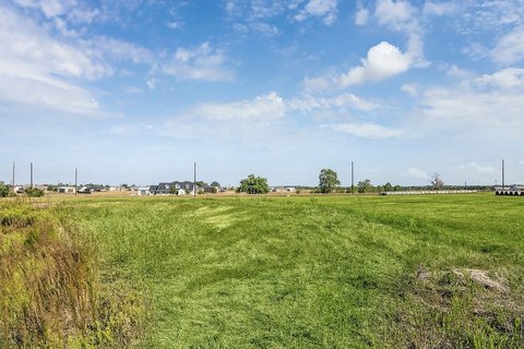 Fenced Cleared Ranch Land with Pond