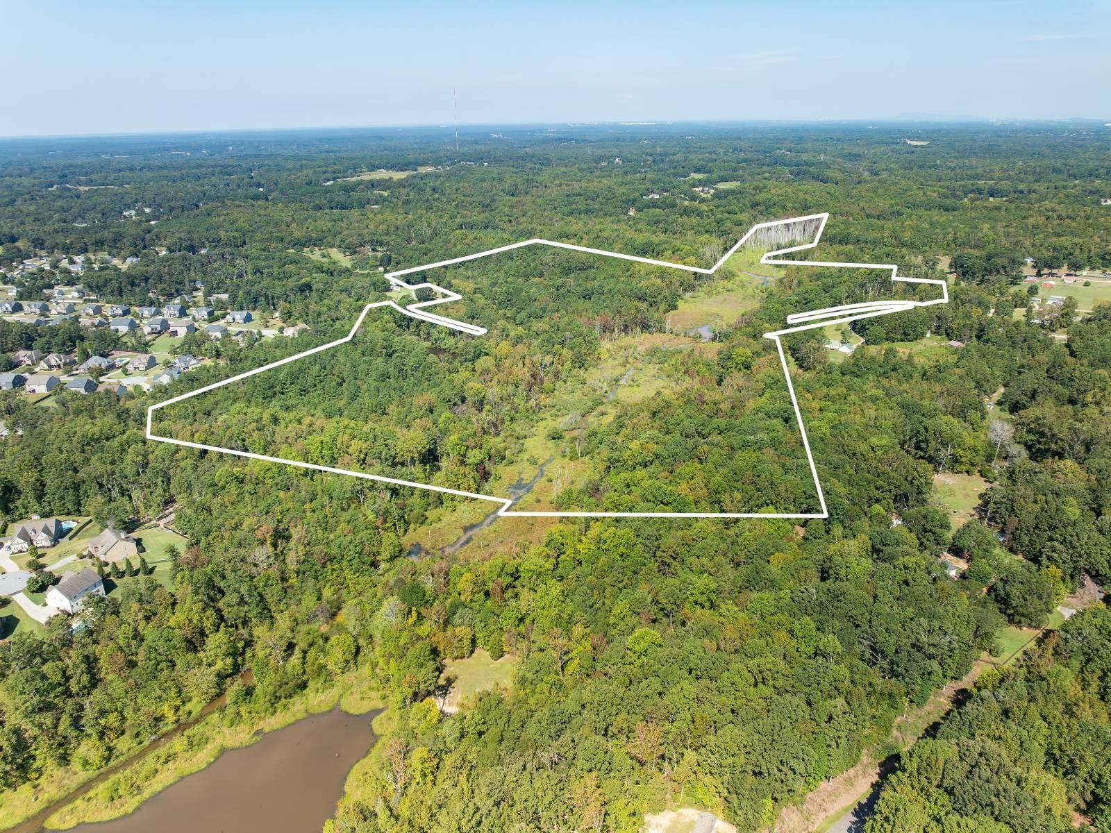 Unrestricted Land with Pond and Creek