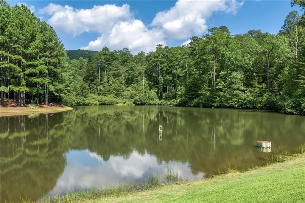 Land with Mountain and Pond Views