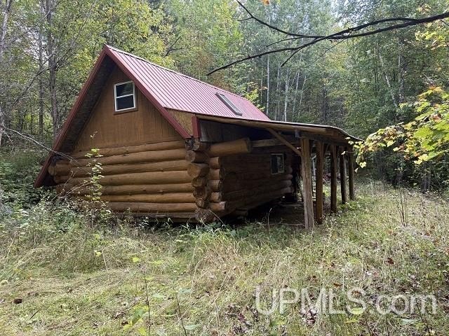 Secluded Land with Log Cabin