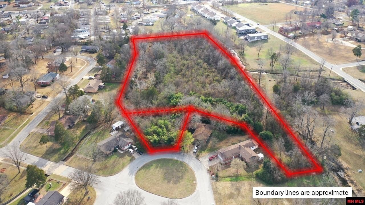Rare In-Town Acreage with Creek