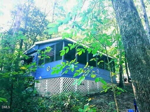 Land with Camper Near Lake