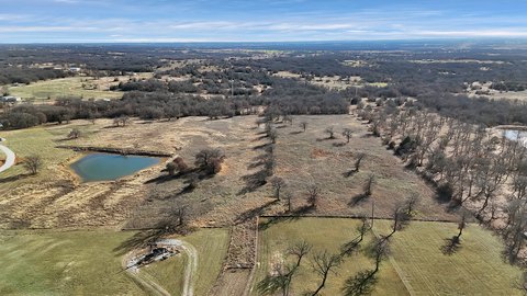 Fenced Acreage Lot with Mature Trees