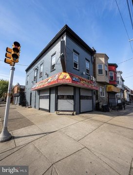 Corner Mixed-Use Building with Apartment
