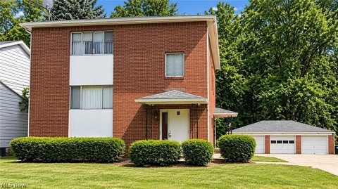 Brick Triplex with Garage Bays