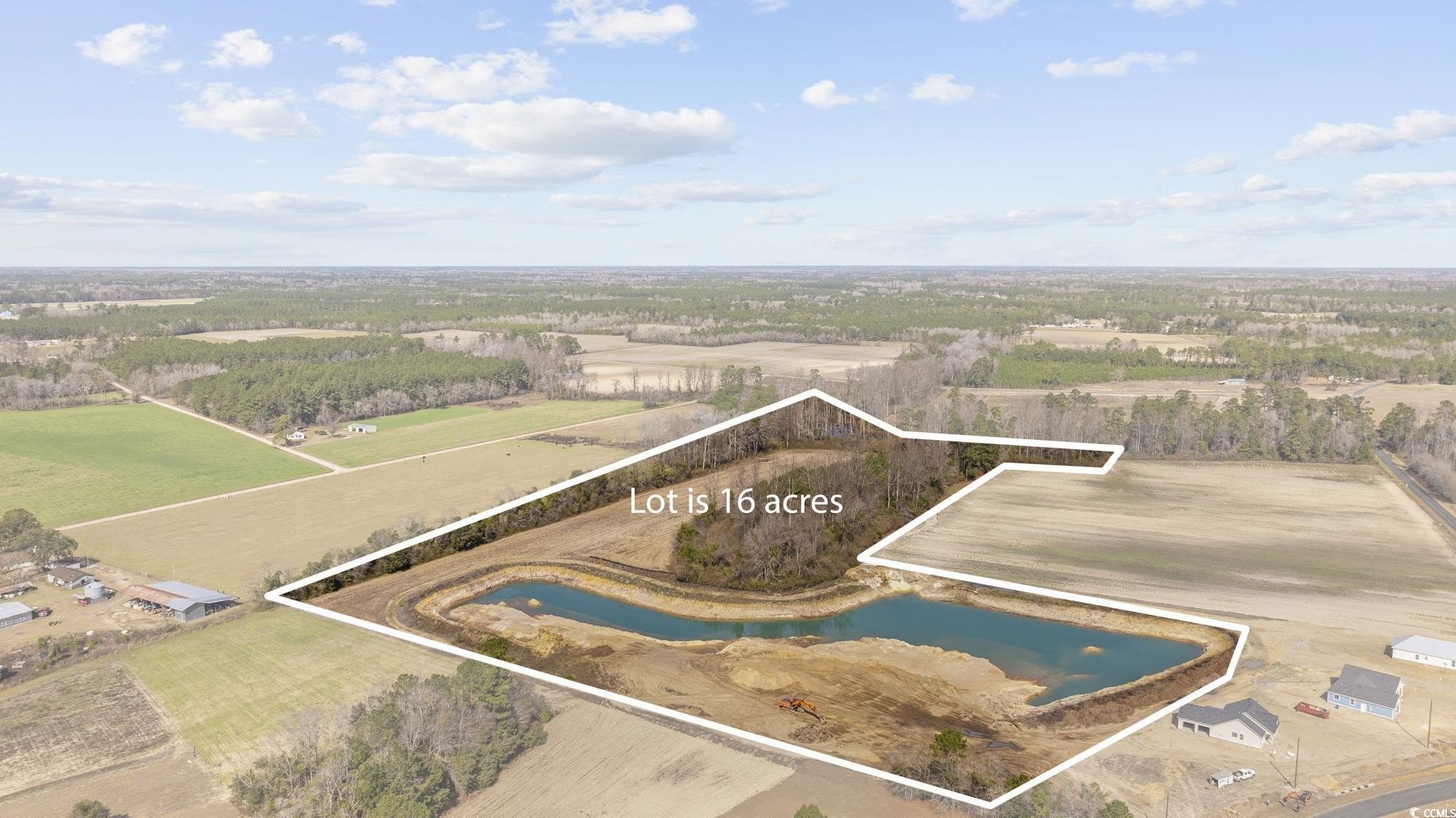 Expansive Land with Serene Pond