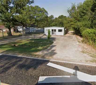 Fenced Commercial Land with Included Building