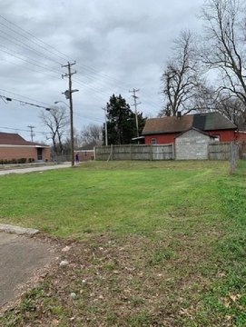 Corner Lot with Brick Building