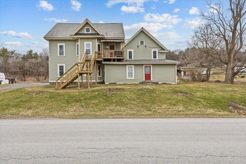 Three-Unit Farmhouse With Garage