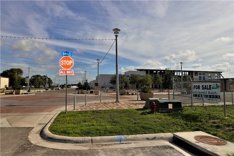 Fenced Corner Commercial Land Parcel