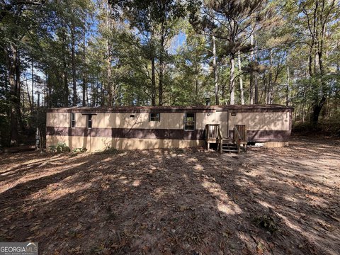 Income-Producing Mobile Home on 1/2 Acre