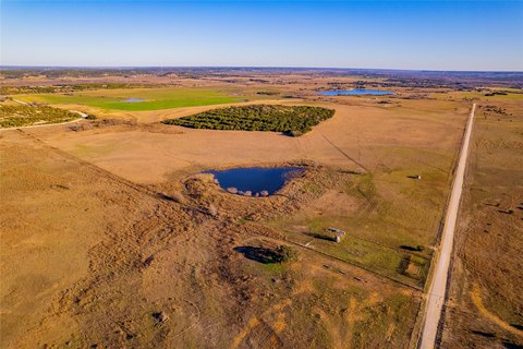 20 Acres with Pond in Country