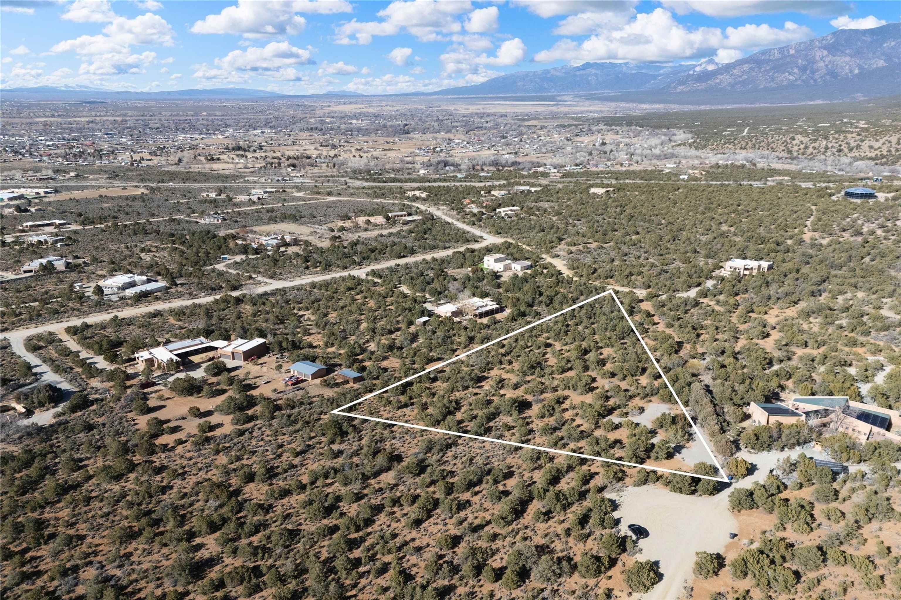 Land with Mountain and City Views