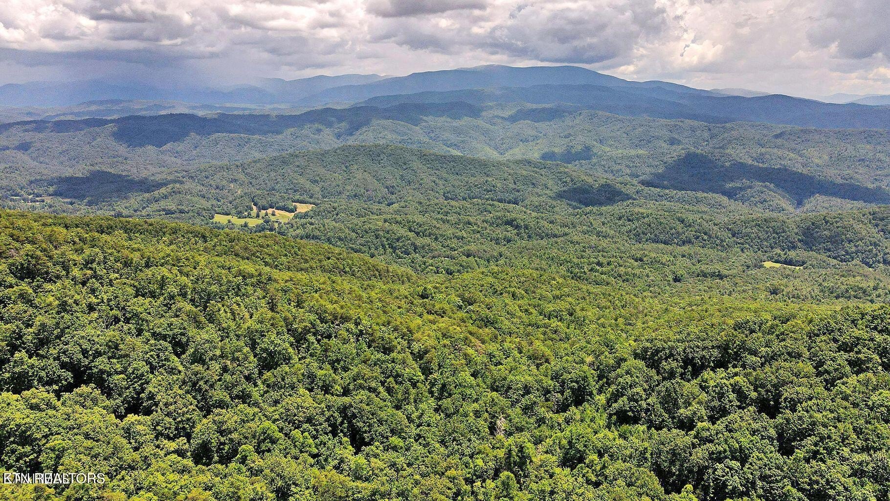Land with Mountain and Lake Views
