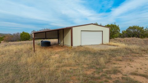 Land with Metal Shop Building