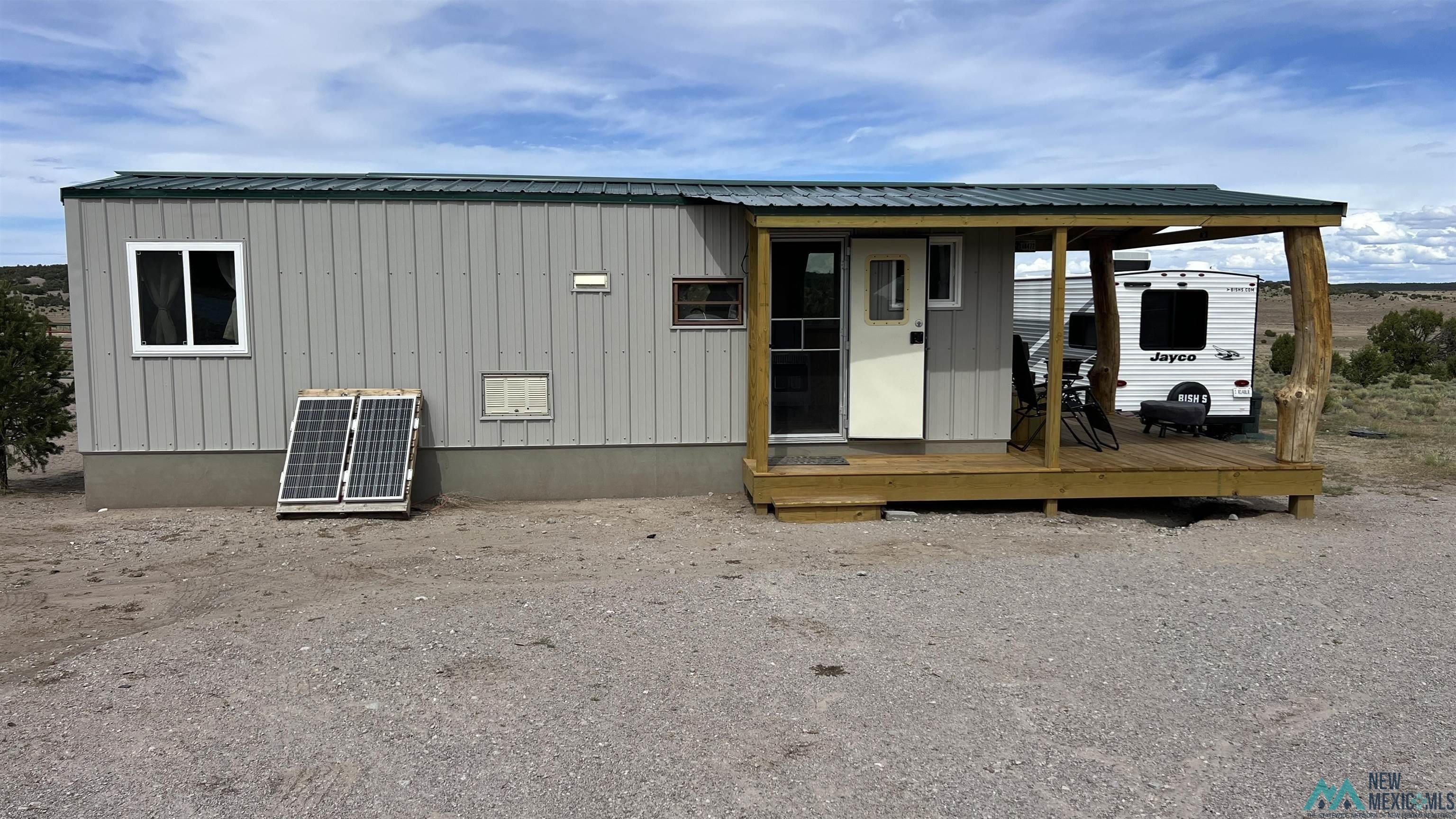 Land with Tiny House and Barn