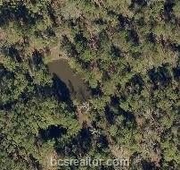 Heavily Wooded Land with Ponds