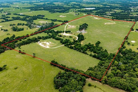 Open Pasture Land with Stock Pond