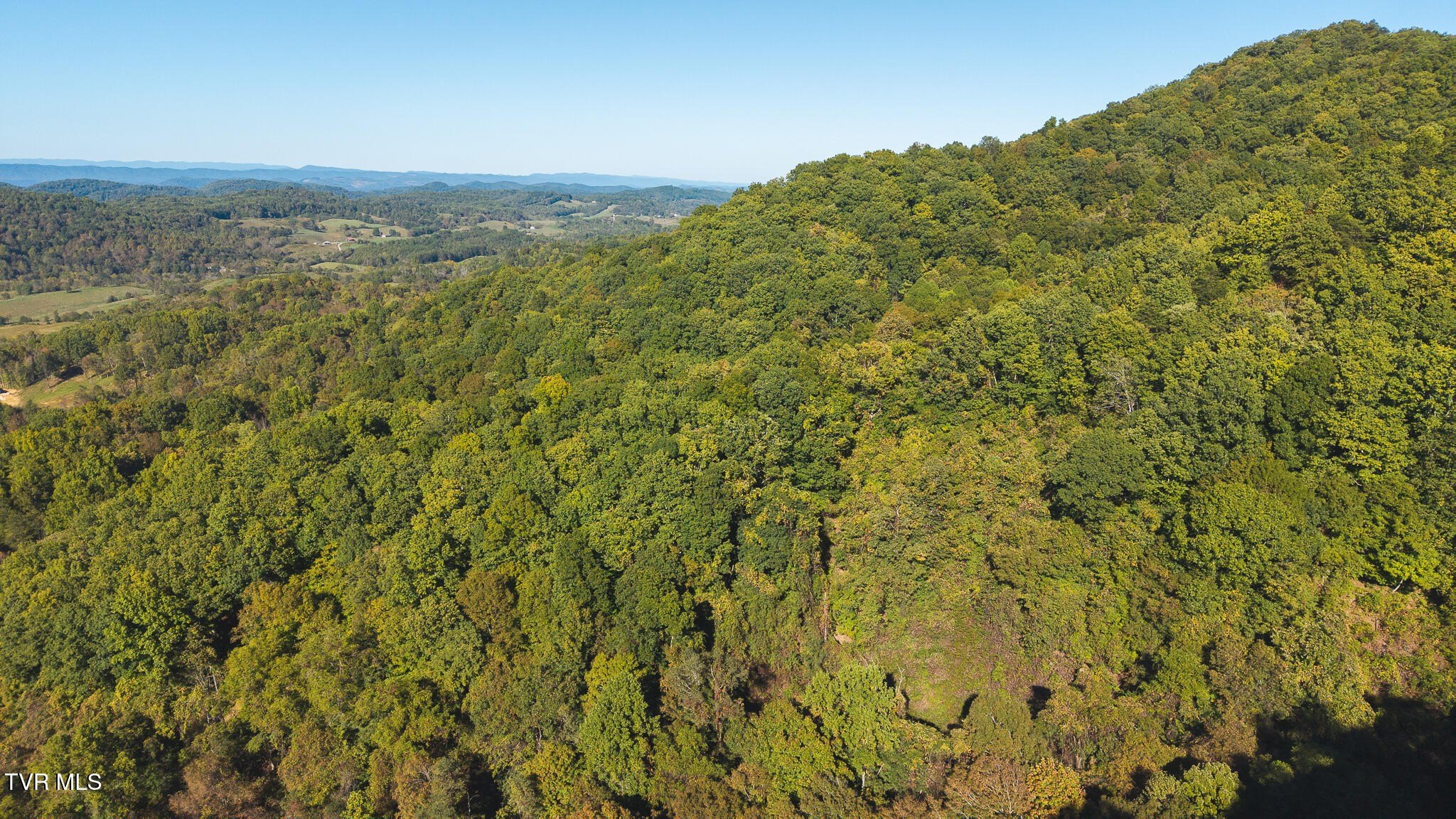 Secluded Mountain Land with Pond