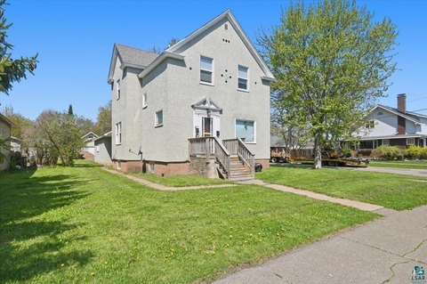 Stucco Triplex with Attached Garage