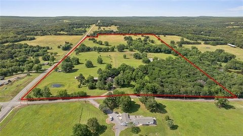 Pond and Tree-Lined Land Tract
