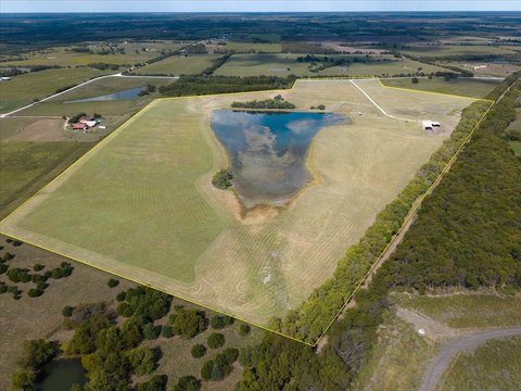 Ranch Land with Pond and Building