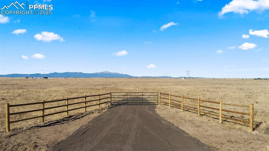 Expansive Fenced Land with Water