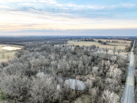 Timbered Land with Pond and Creek