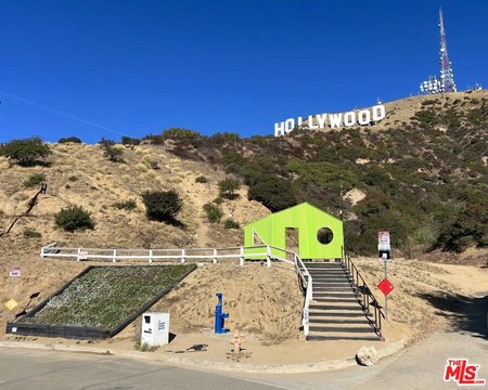 Iconic Hollywood Sign Facing Land
