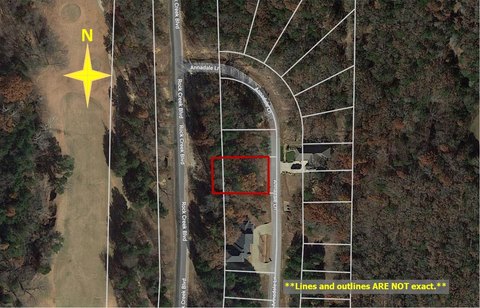 Treed Waterfront Lot in Resort