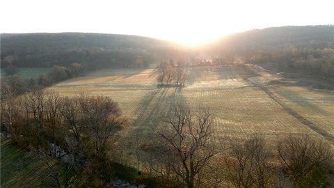 Pastureland with Creek Near Town