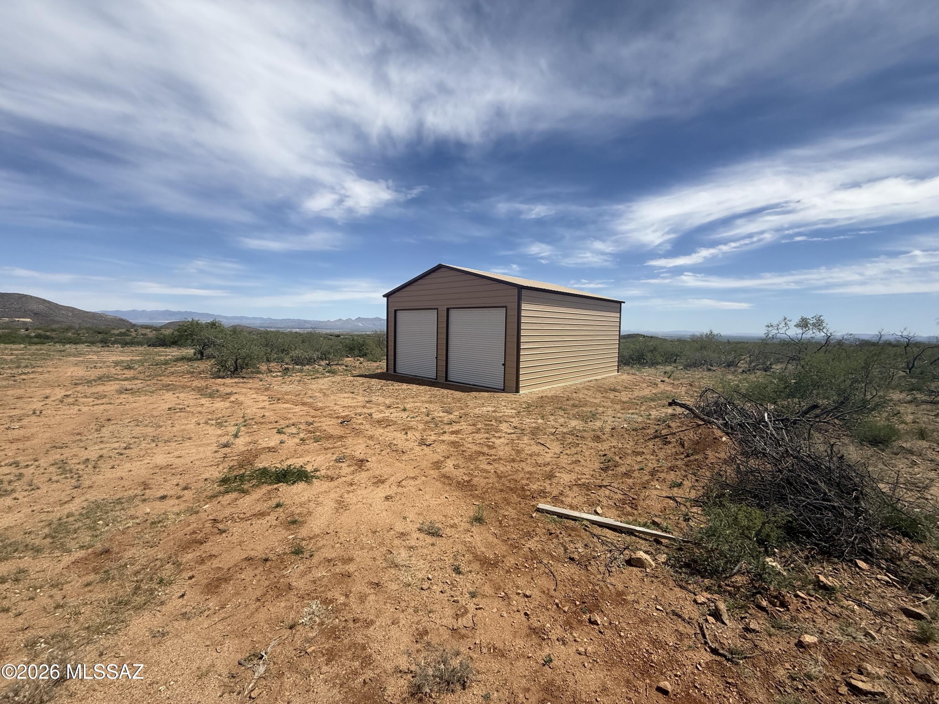 Land with Metal Building Awaits