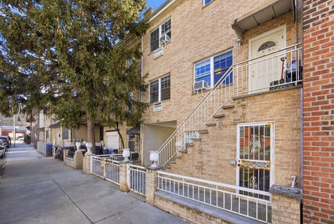 Two-Family Brick Home with Backyard