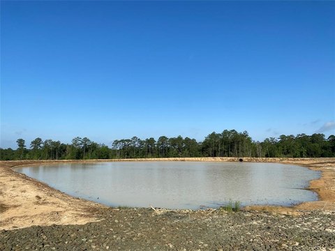Unrestricted Land with Pond in Doucette