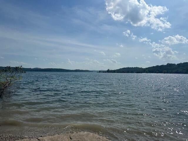 Lakefront Lot with Unfinished Cabin