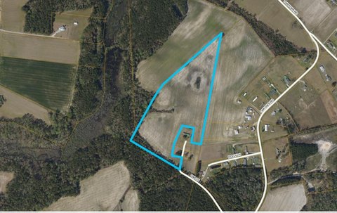 Cleared Land with Small Pond