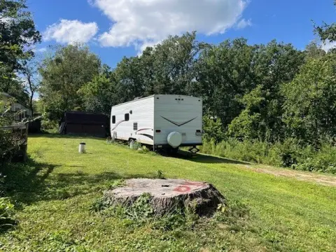 Cleared Lot with Travel Trailer