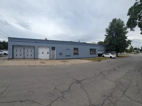 Corner Brick Building with Apartment